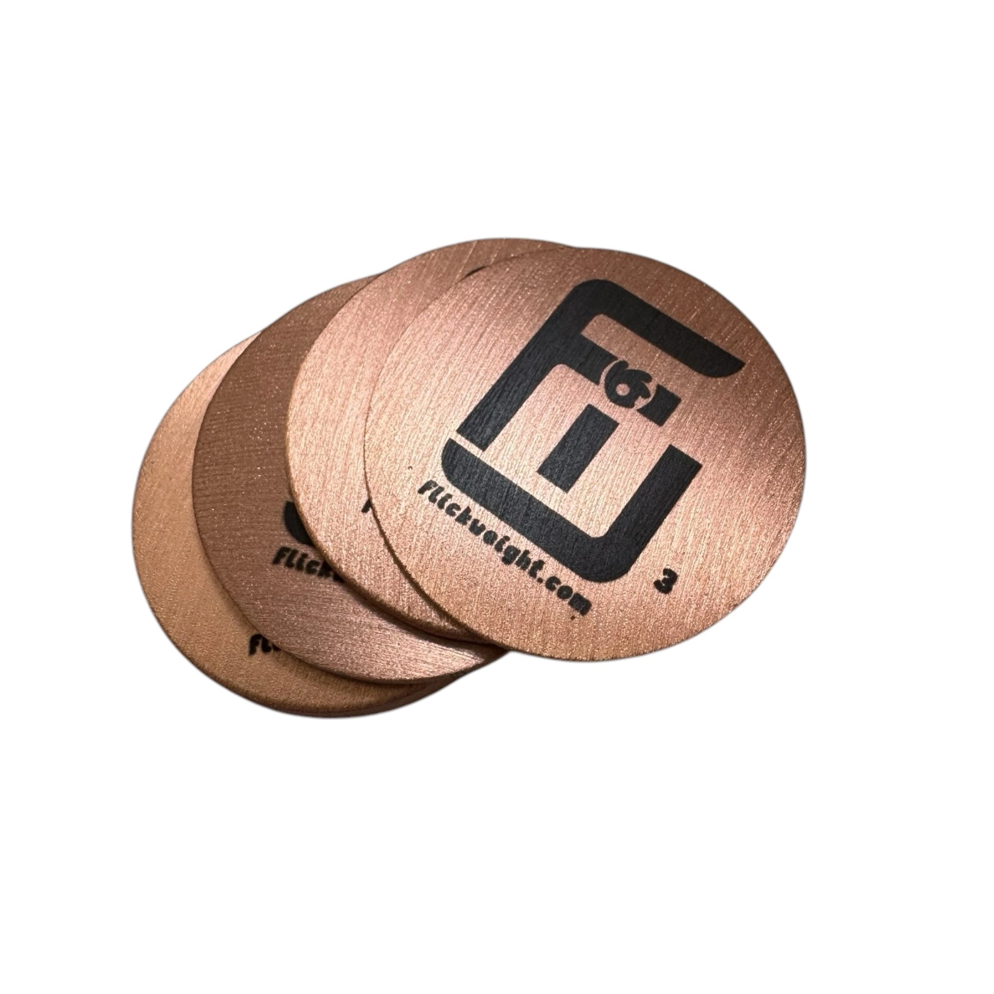 4 lick weights stacked so you can see their shine and polish on copper pickleball weights
